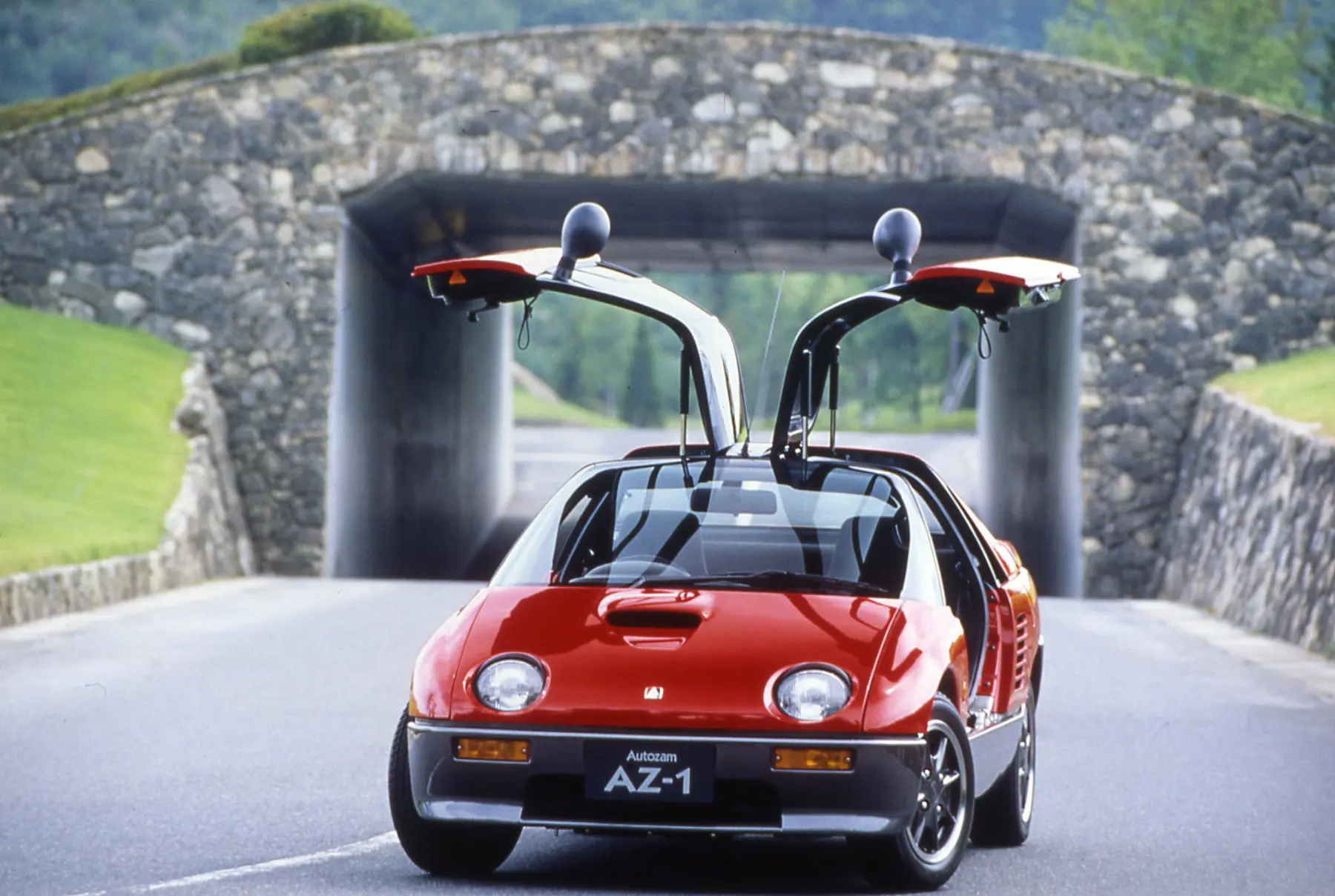 Red car with doors open