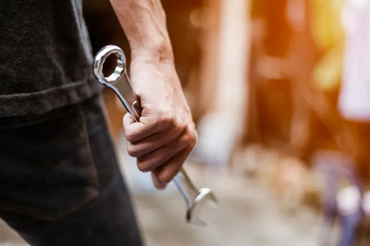 Mechanic with spanner