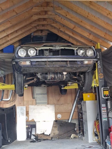 Car being lifted for repairs