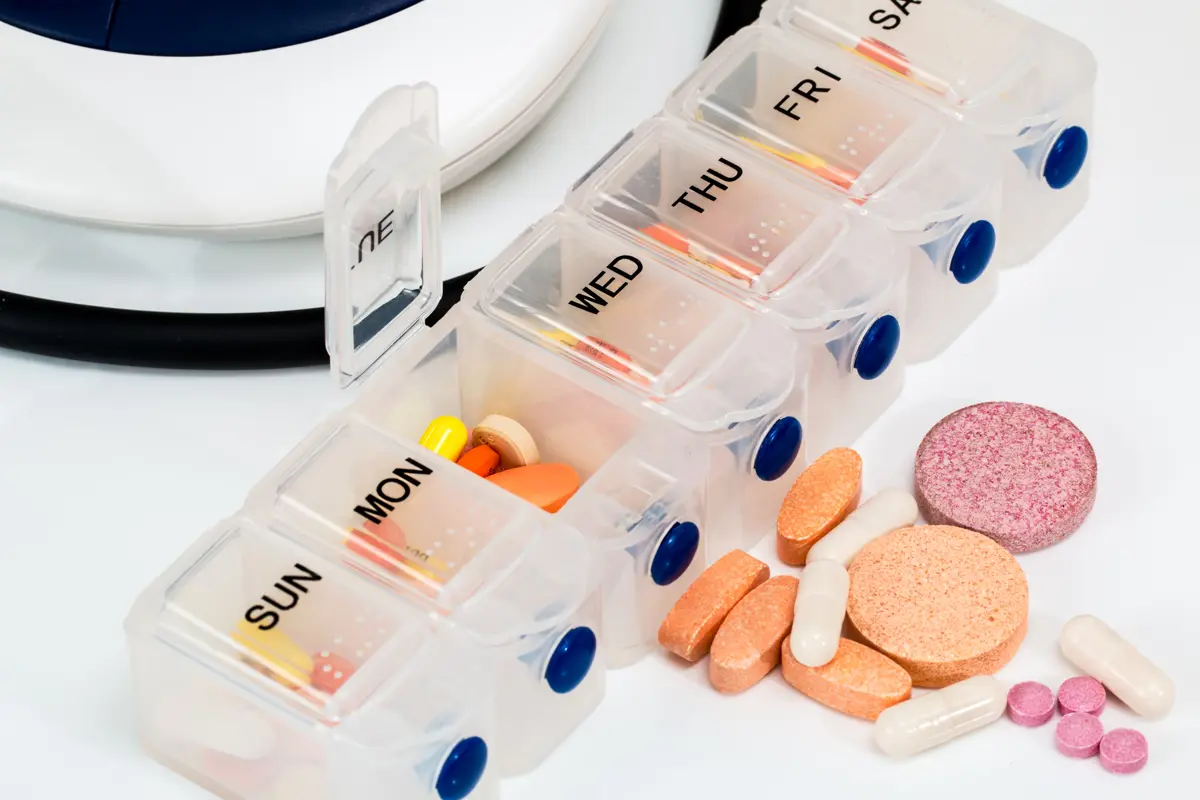 A box of prescription medication with the days of the week labelled on each section