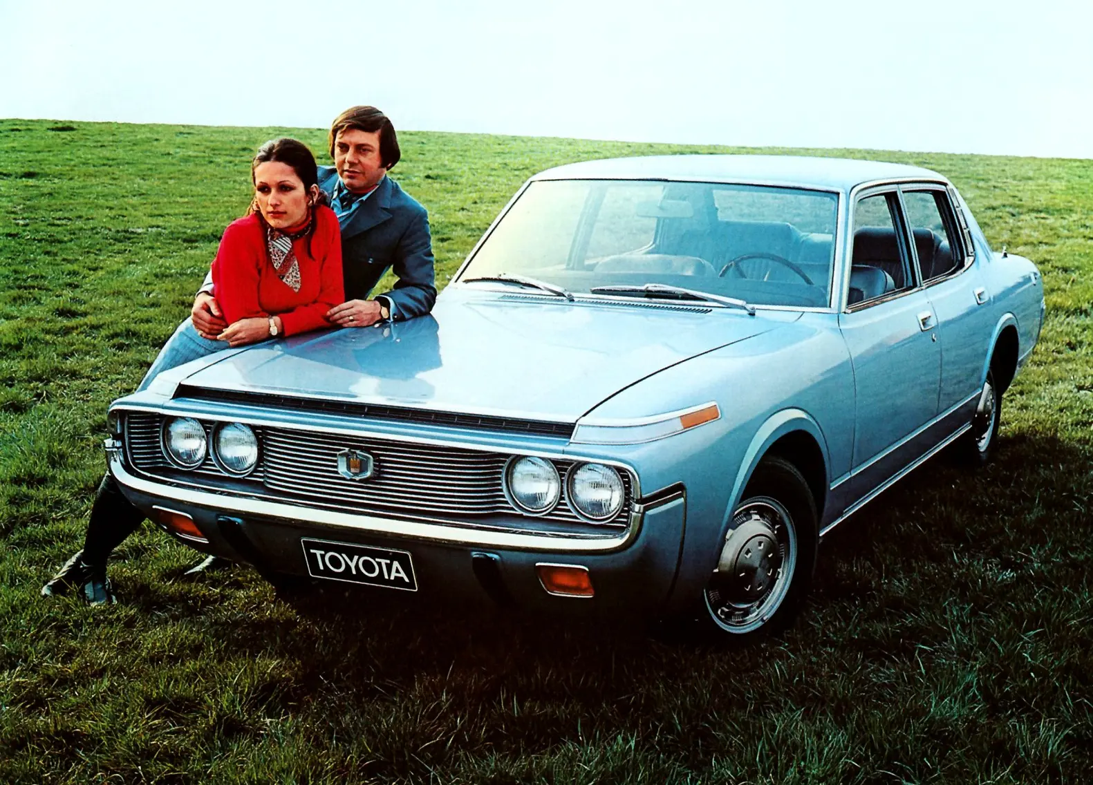Blue car in field