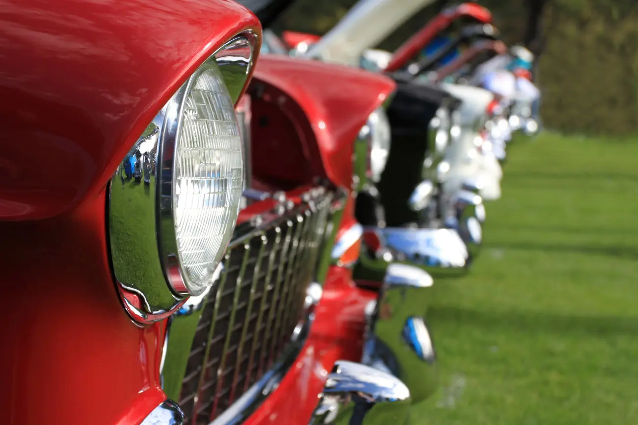 Close-up on a classic red car bonnet