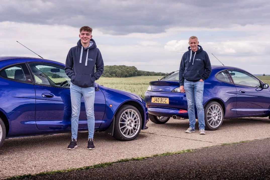 Men with blue cars
