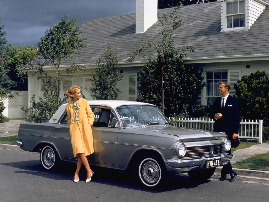 People standing by car