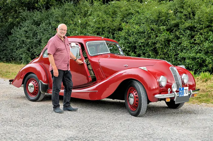 Man with red car